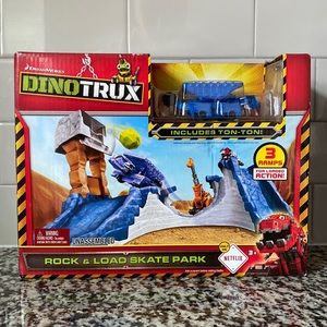 Brand New in box Dinotrux Rock & Load Skate Park set. Includes Ton-Ton figure.